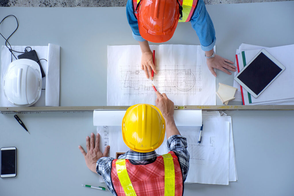architects and engineer planning on blueprint